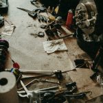 messy-garage-mechanic-floor-tools-car-repair-maint-2021-09-18-17-27-25-utc~1